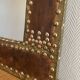 Large vintage mirror in studded leather and brass