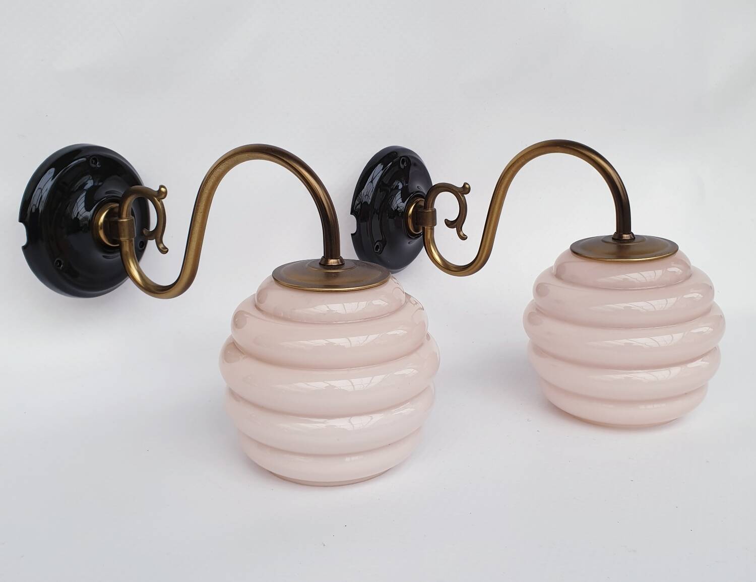 Swan neck wall lights in brass and glass