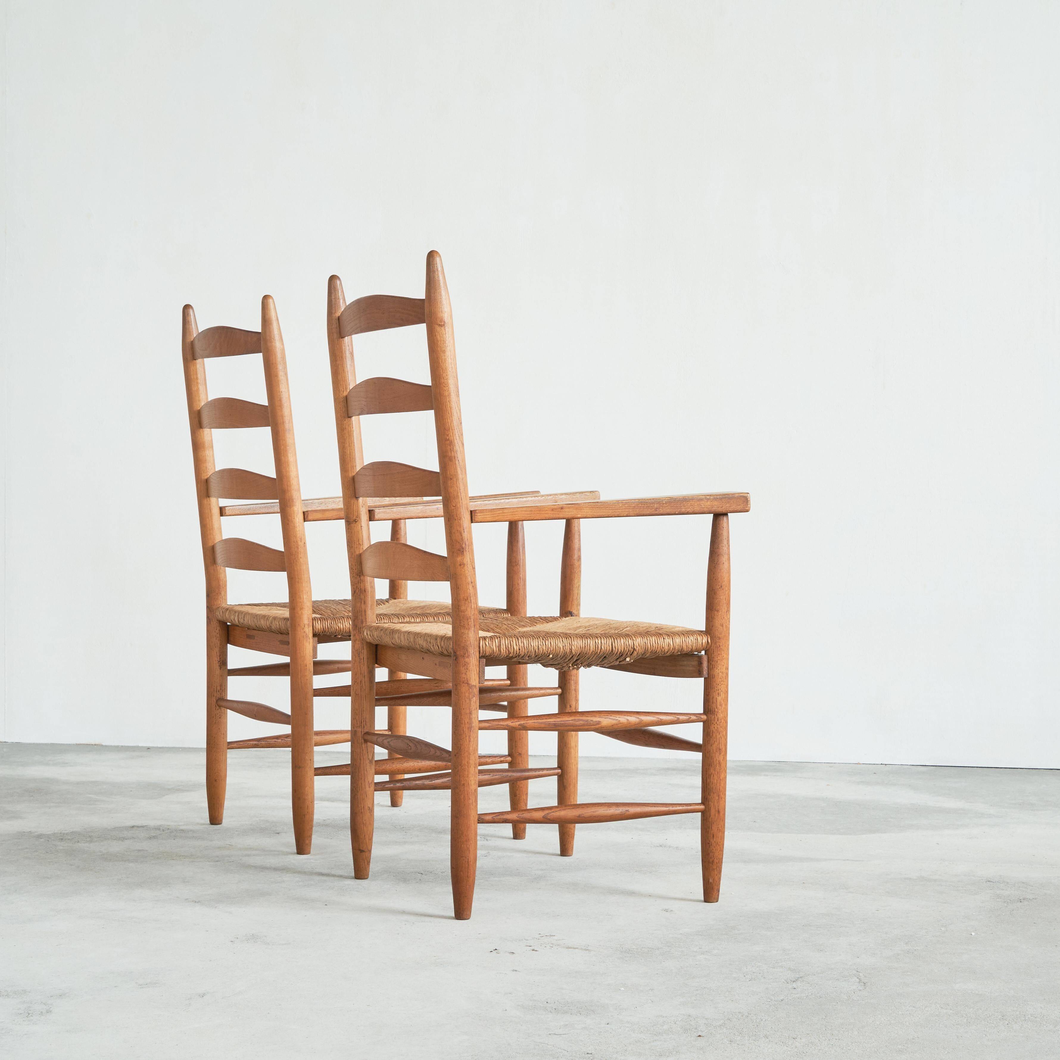 Set of 2 oak and wicker armchairs, mid-20th century.