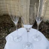 Set of 3 engraved champagne flutes.