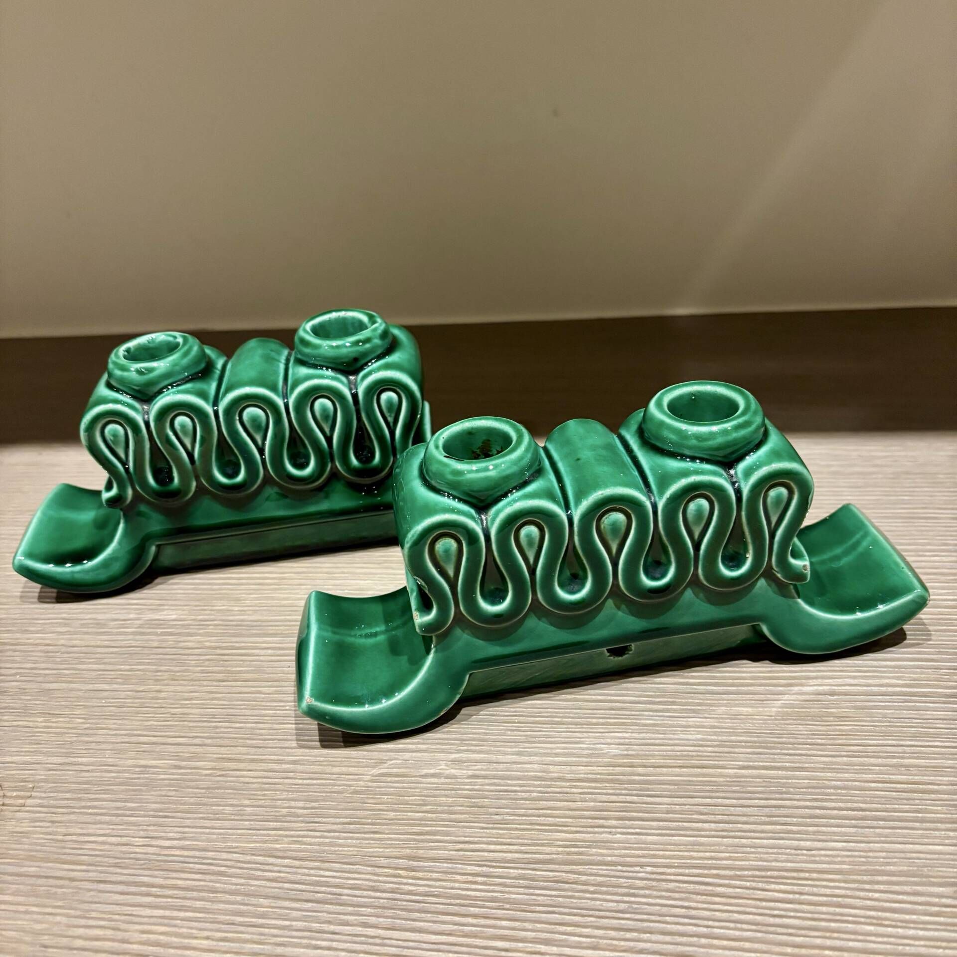 Pair of Art Deco green ceramic candlesticks