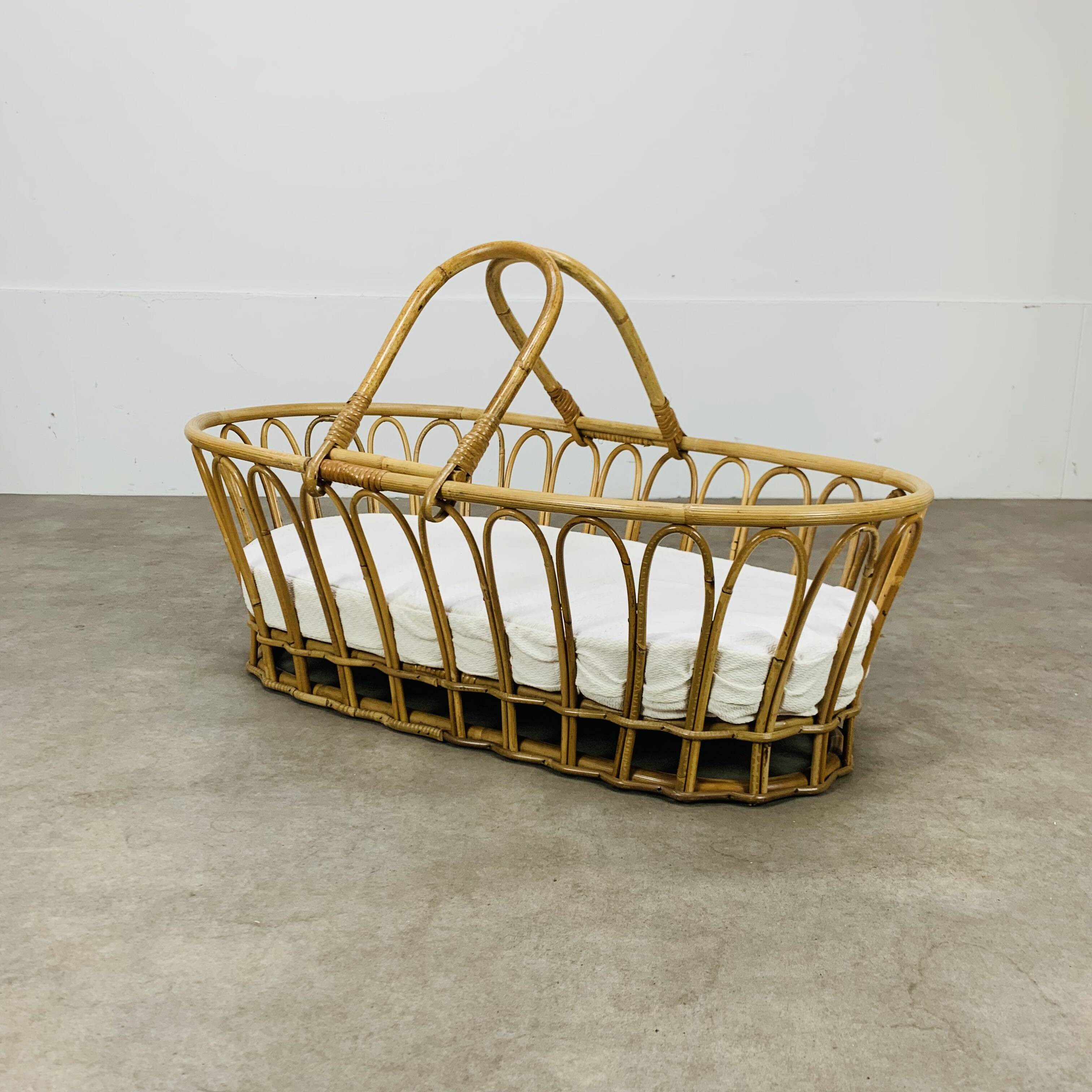 Vintage rattan baby bassinet