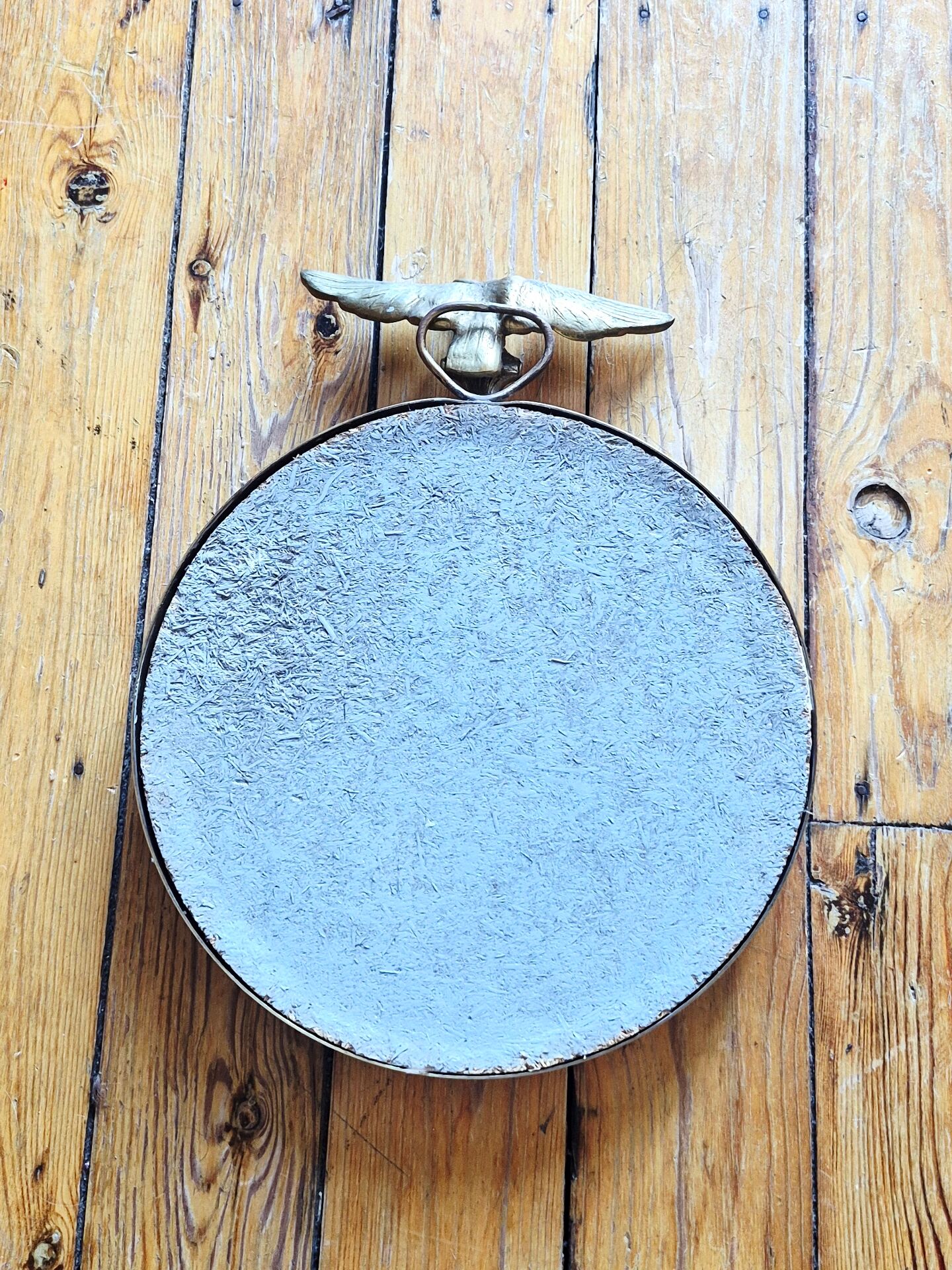 Vintage convex witch mirror with triumphant eagle.