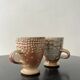 Set of 2 enamelled stoneware mugs with stylised polka dots.