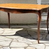 Solid wood table with curved legs
