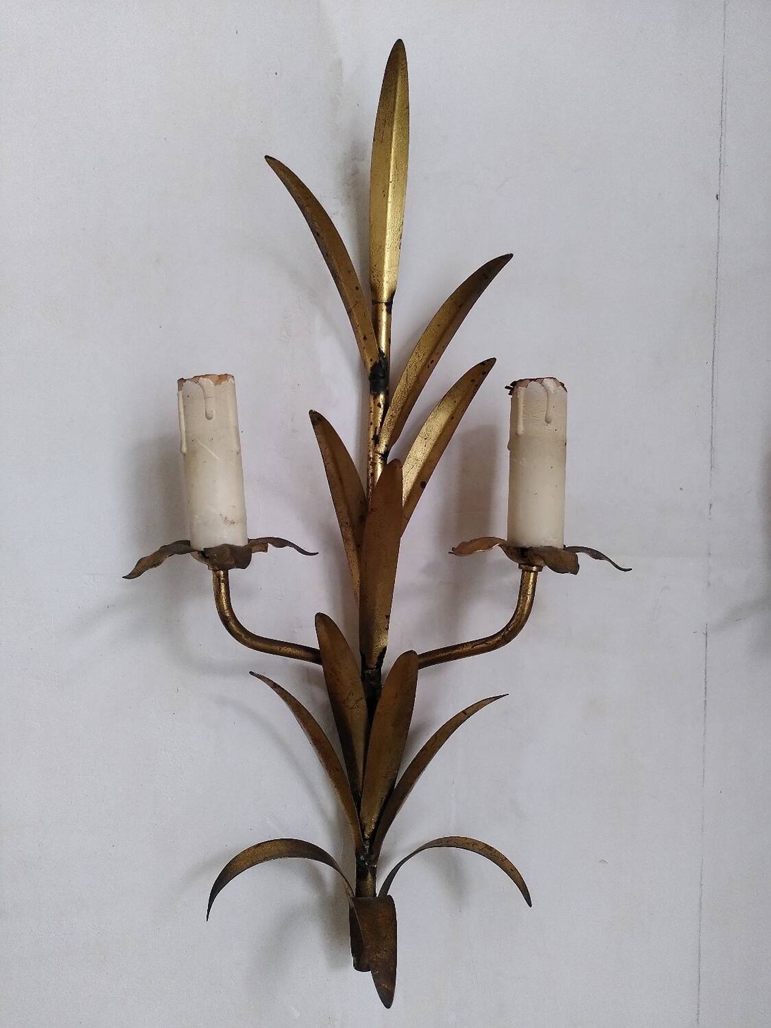 Pair of gold metal leaf wall sconces
