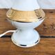 Porcelain table lamp and glass globe