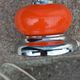 Designer lamp from the 70s in chrome metal and orange lacquered wood