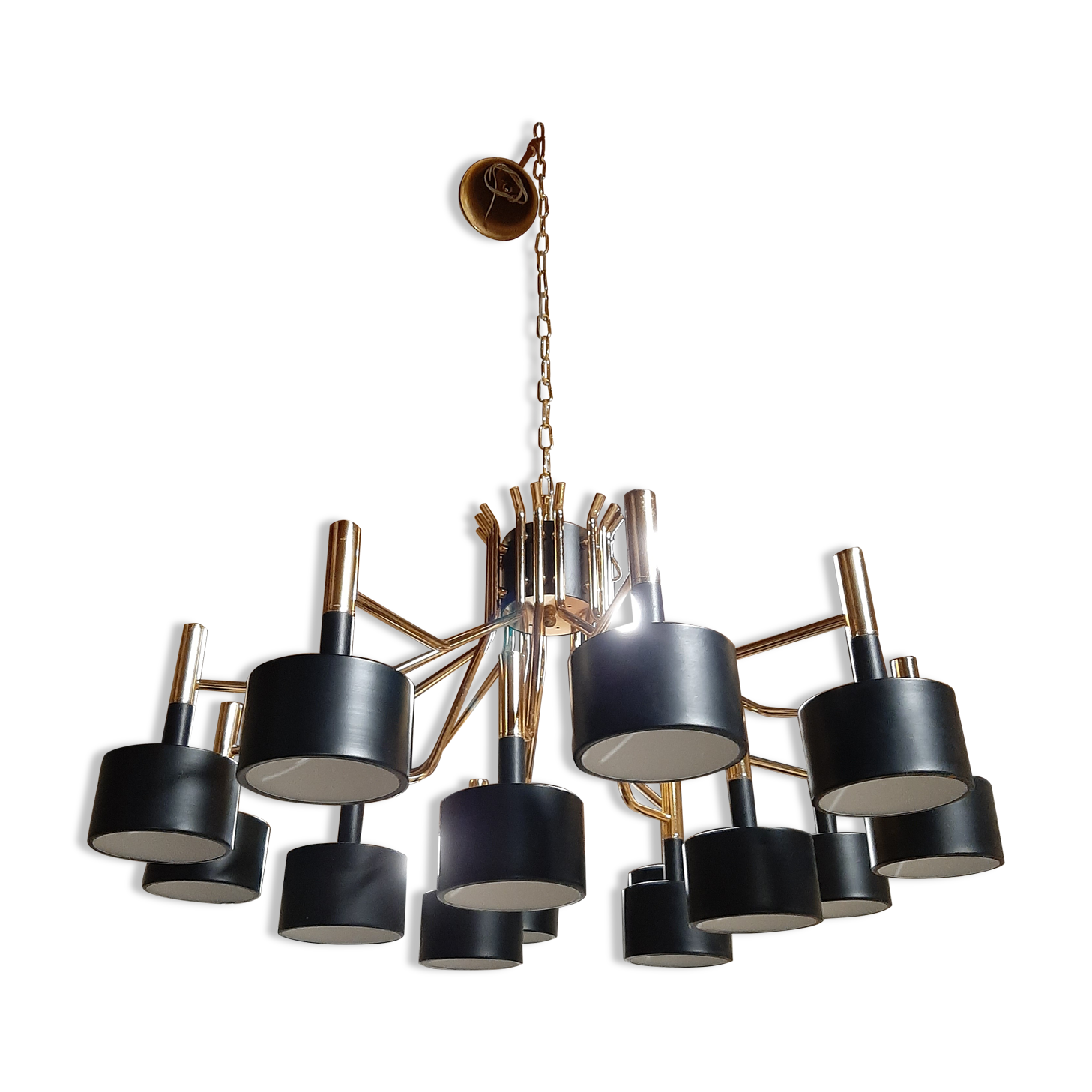 Black chandelier and gilded metal