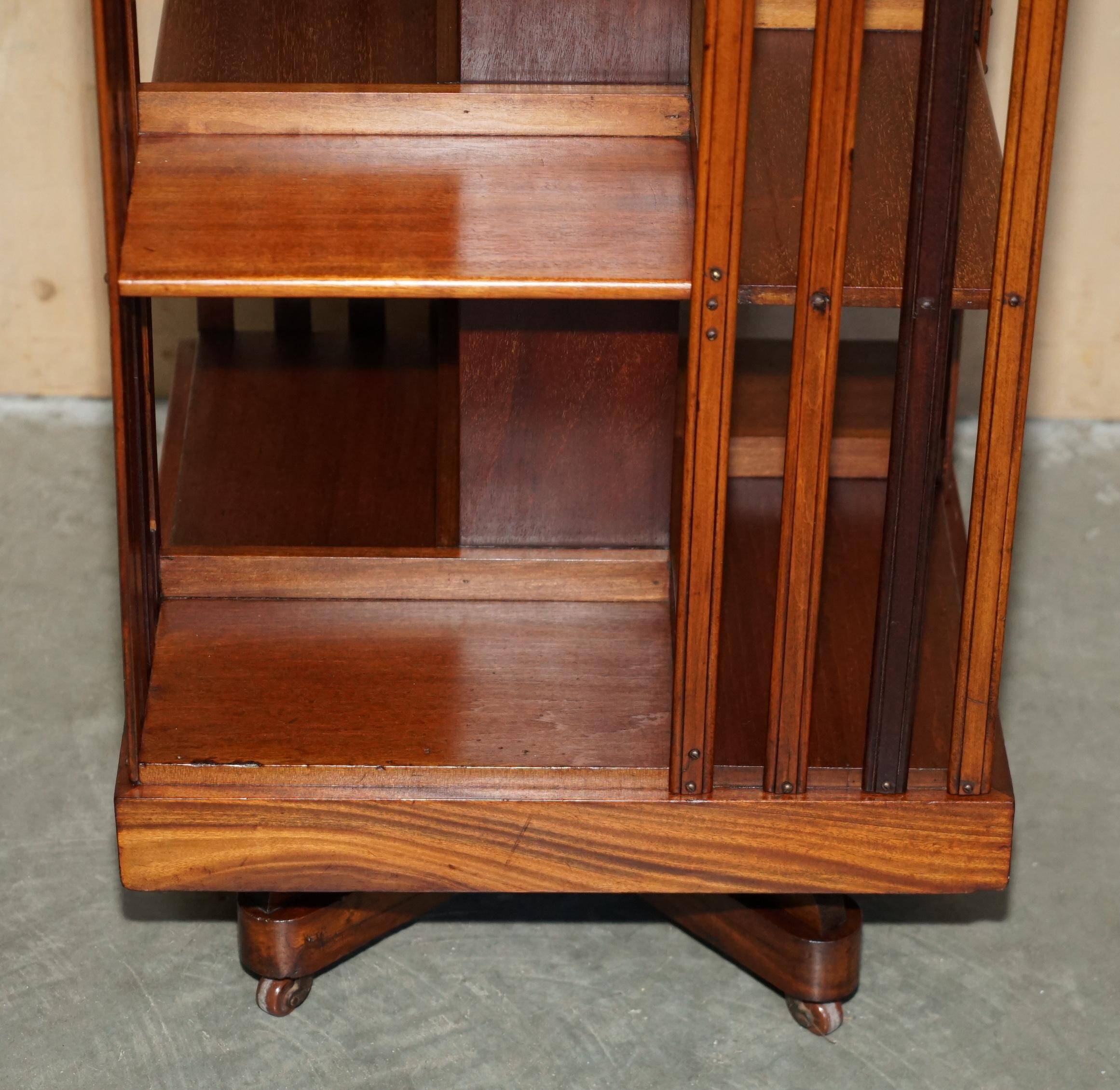 Sheraton-style rotating library table in walnut and satinwood.