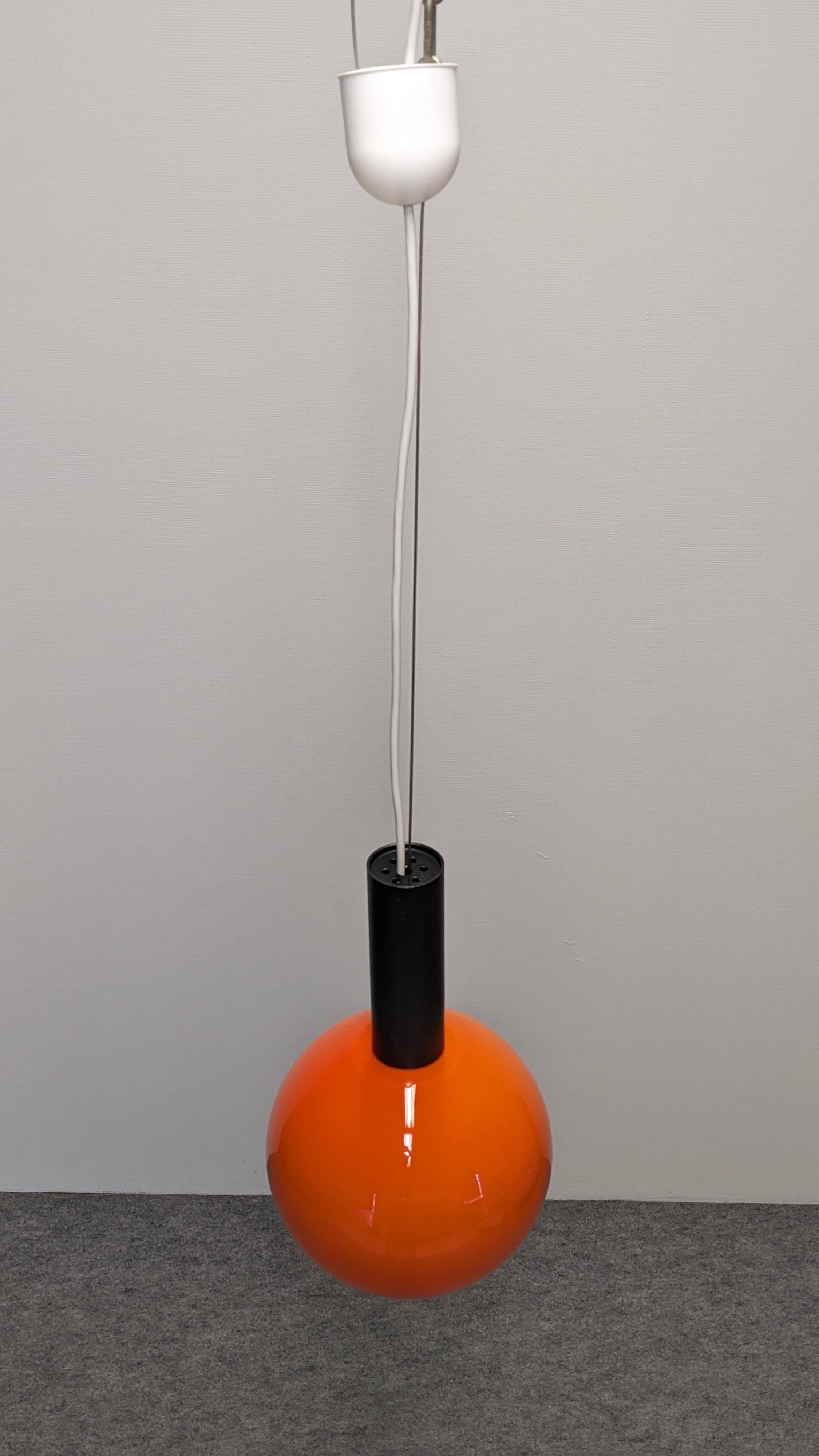 Pair of orange opaline ball pendants by Parscot, France circa 1970.