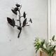 Wall lamp in wrought iron.