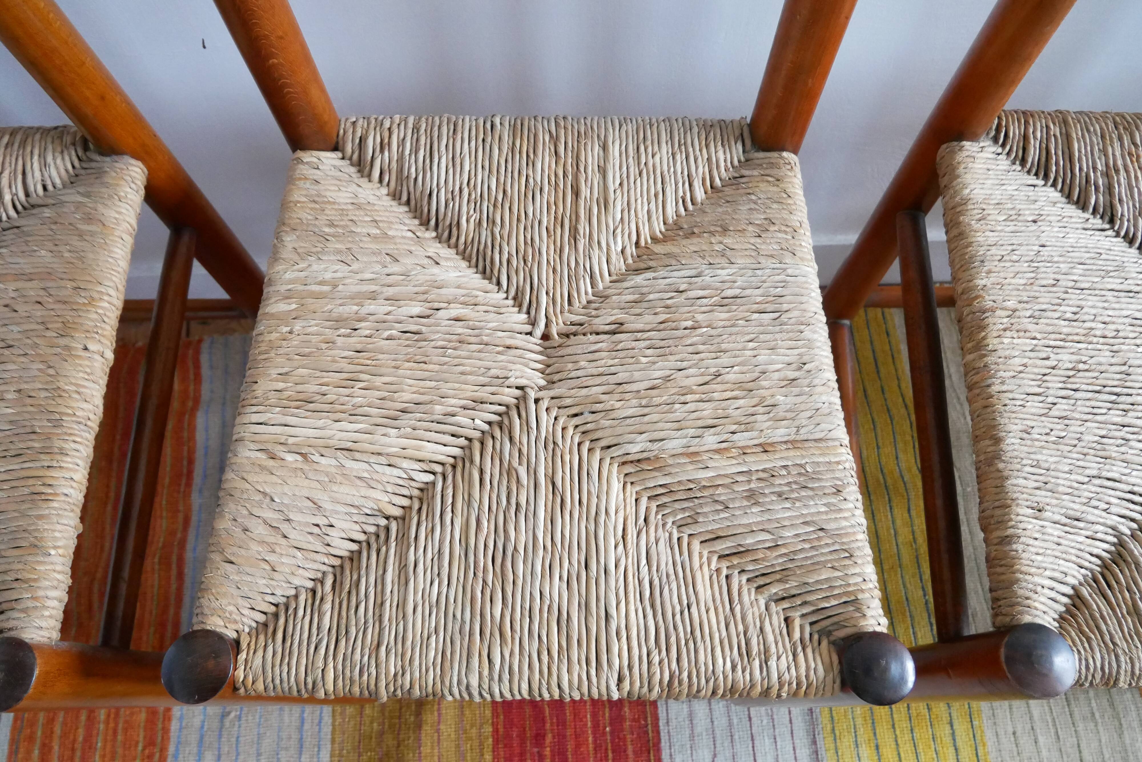 Set of 4 straw chairs and a stool