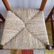 Set of 4 straw chairs and a stool