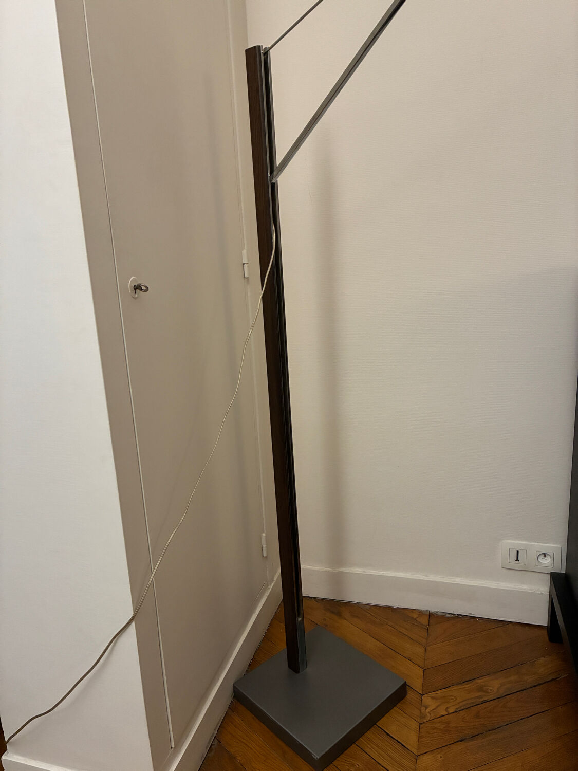 Cinna floor lamp in wood, chrome, and fabric.