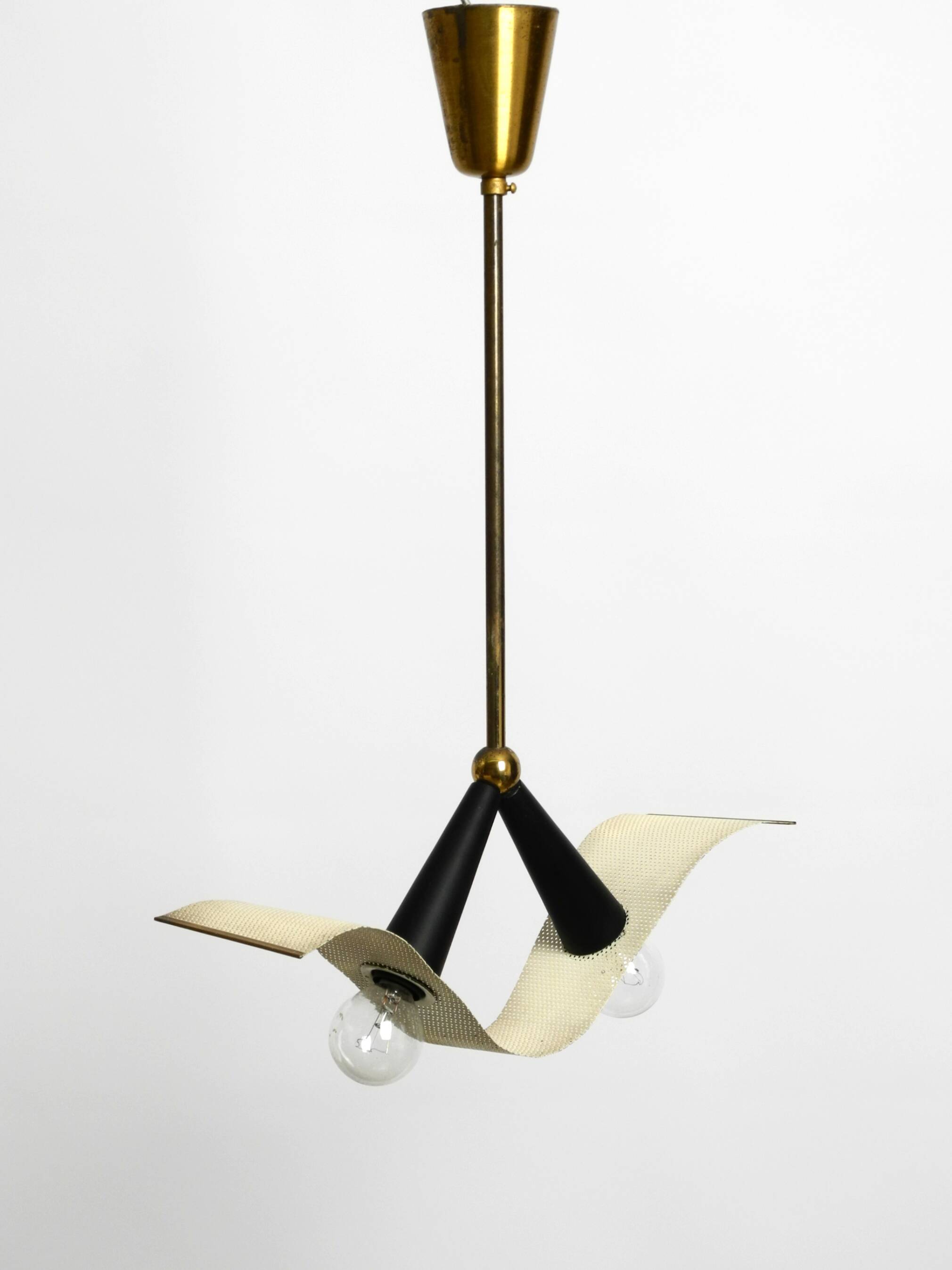 Mid Century brass ceiling lamp with a curved perforated sheet lampshade