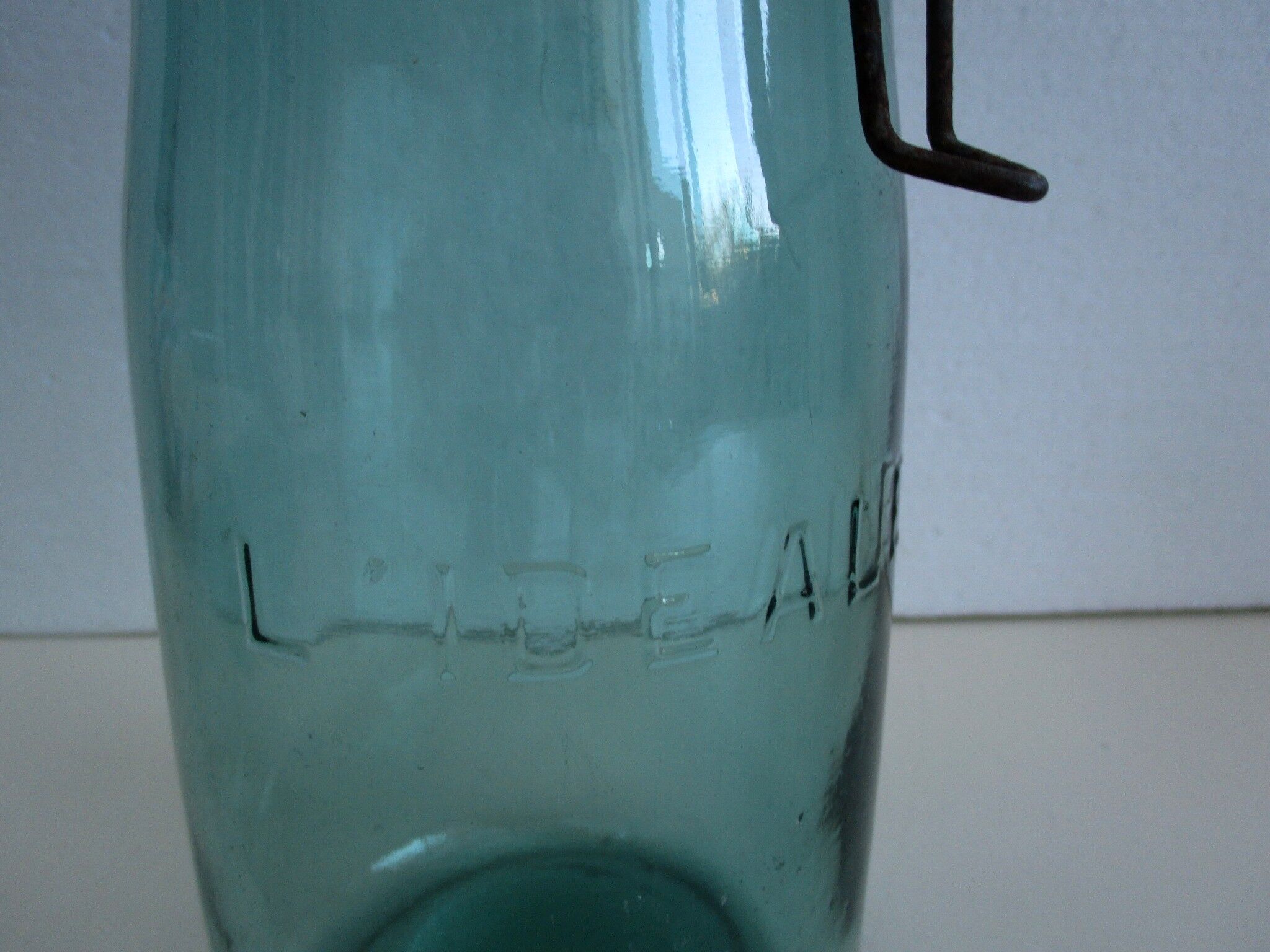 Old green glass jar "L'IDEALE"