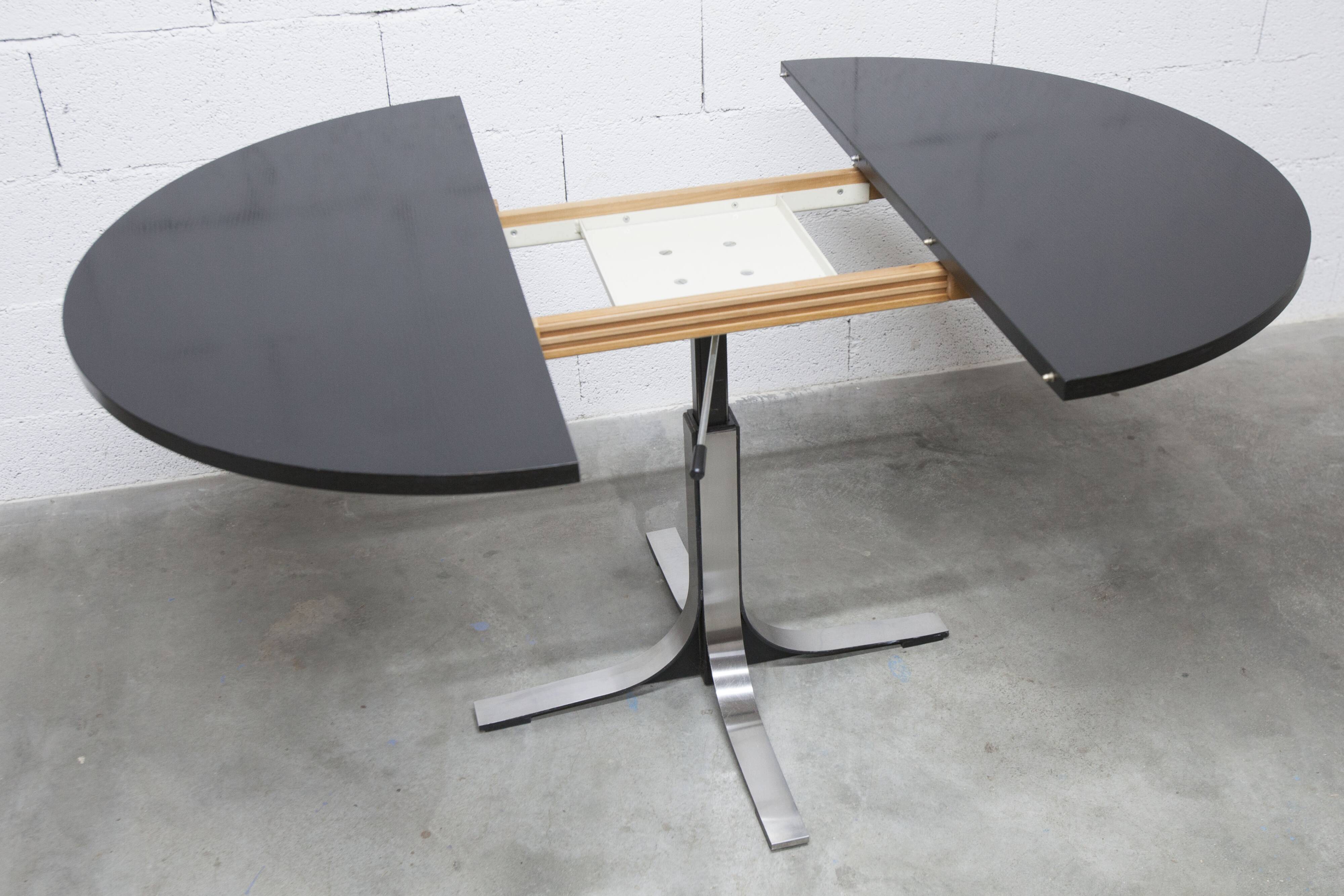 Round table rises and lowers Osvaldo Borsani black and chrome with extension