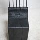Brutalist chair, black-stained raw wood, steel. Work from the 1970s