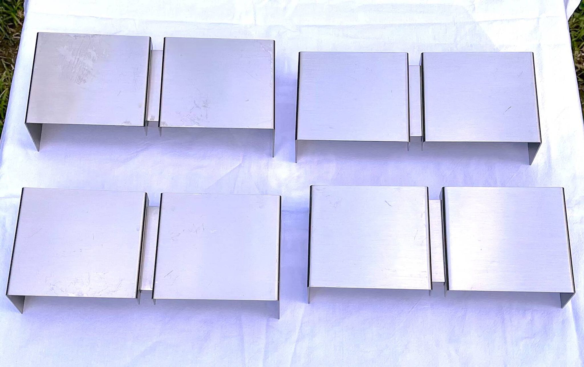 Four modern metal wall lights by Christophe Gevers for Axis71, Belgium