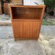 Brown trapezoidal wooden bar cabinet from the 1960s with a niche and lockable flap.