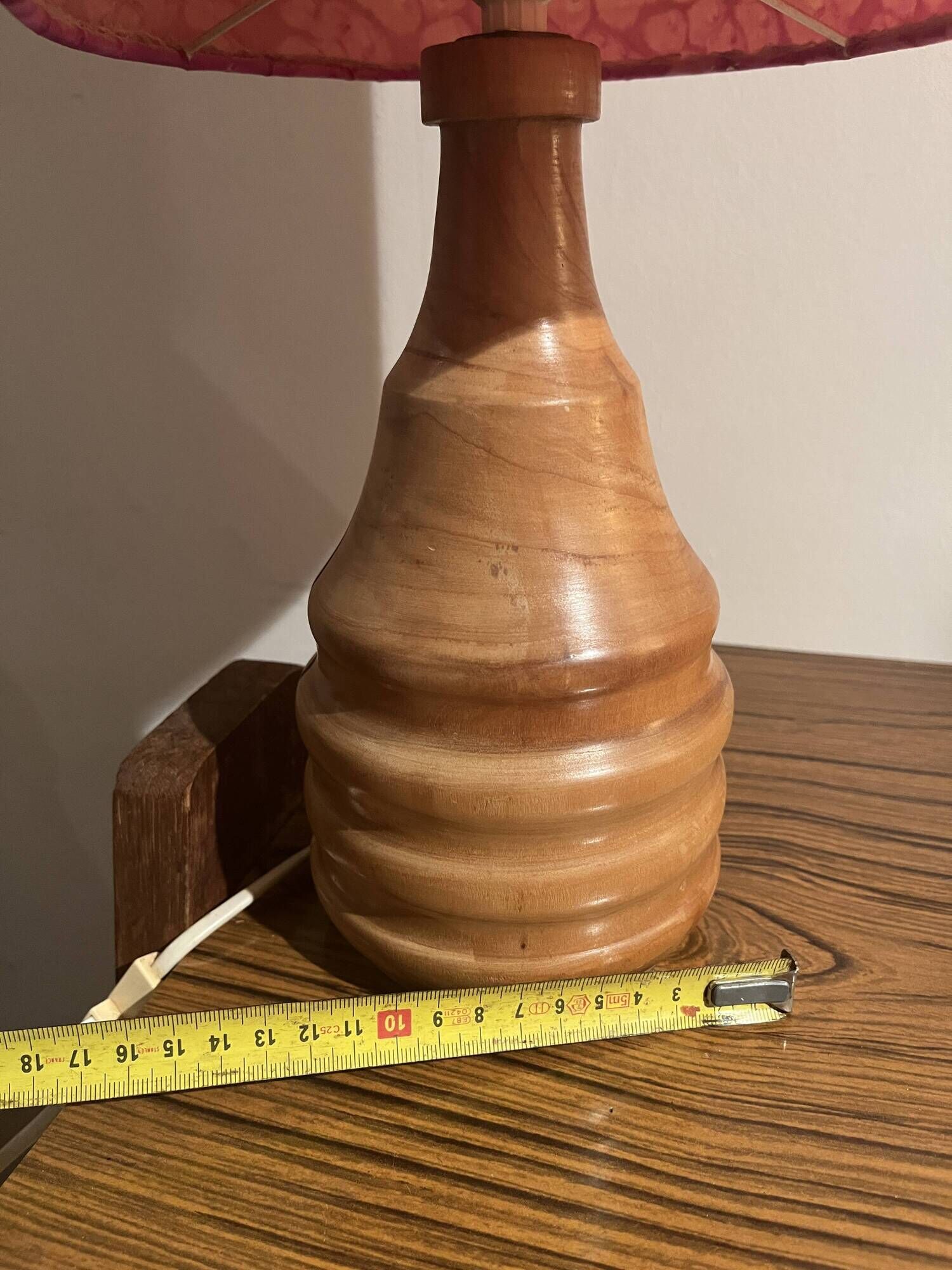 Vintage lamp with a carved wooden base from the 1970s.