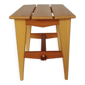 Designer wooden stool or end of sofa