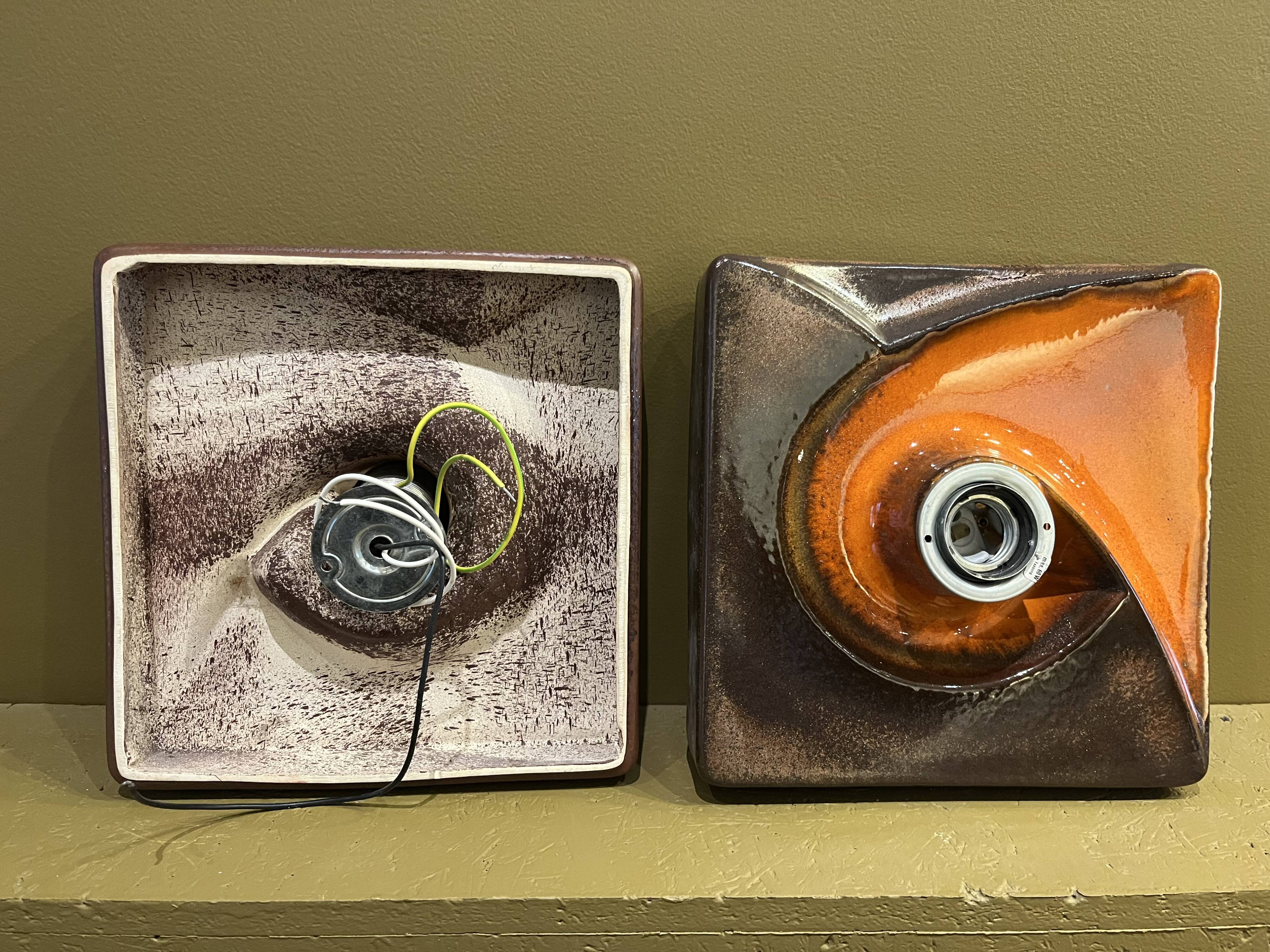 Pair of square ceramic wall sconces.