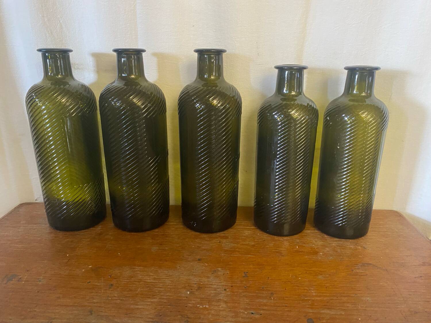 Set of 5 antique carapelli bottles, smoked and ribbed vintage glass