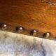 Pair of studded nesting tables from the 1930s.