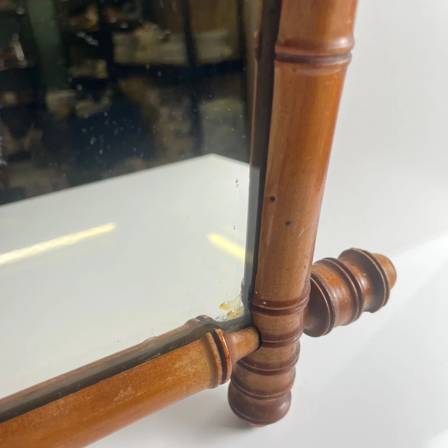 Wooden turned mirror in bamboo style, circa 1900-1930.