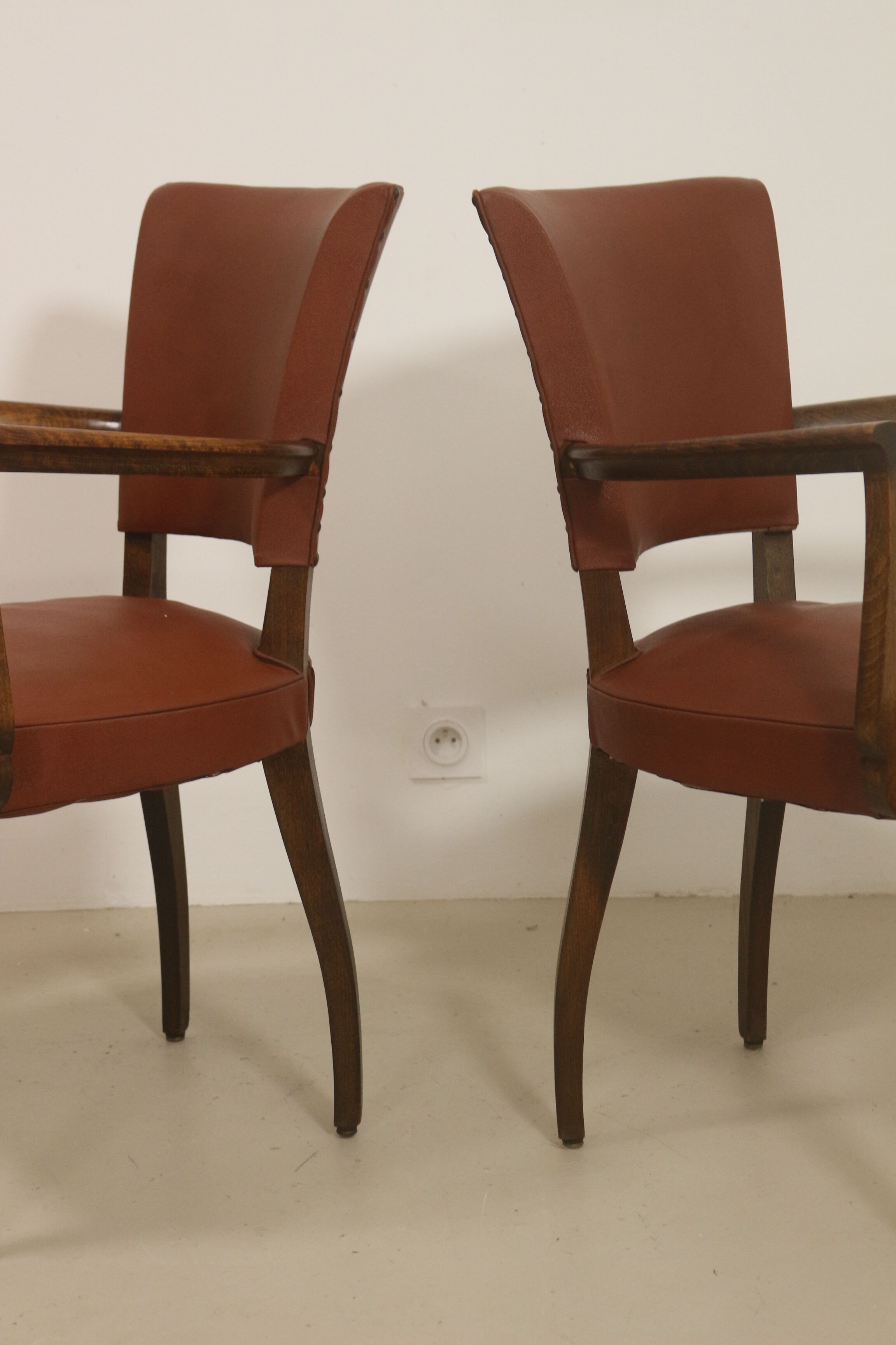 Pair of vintage bridge armchairs year 60 in imitation rust leather.