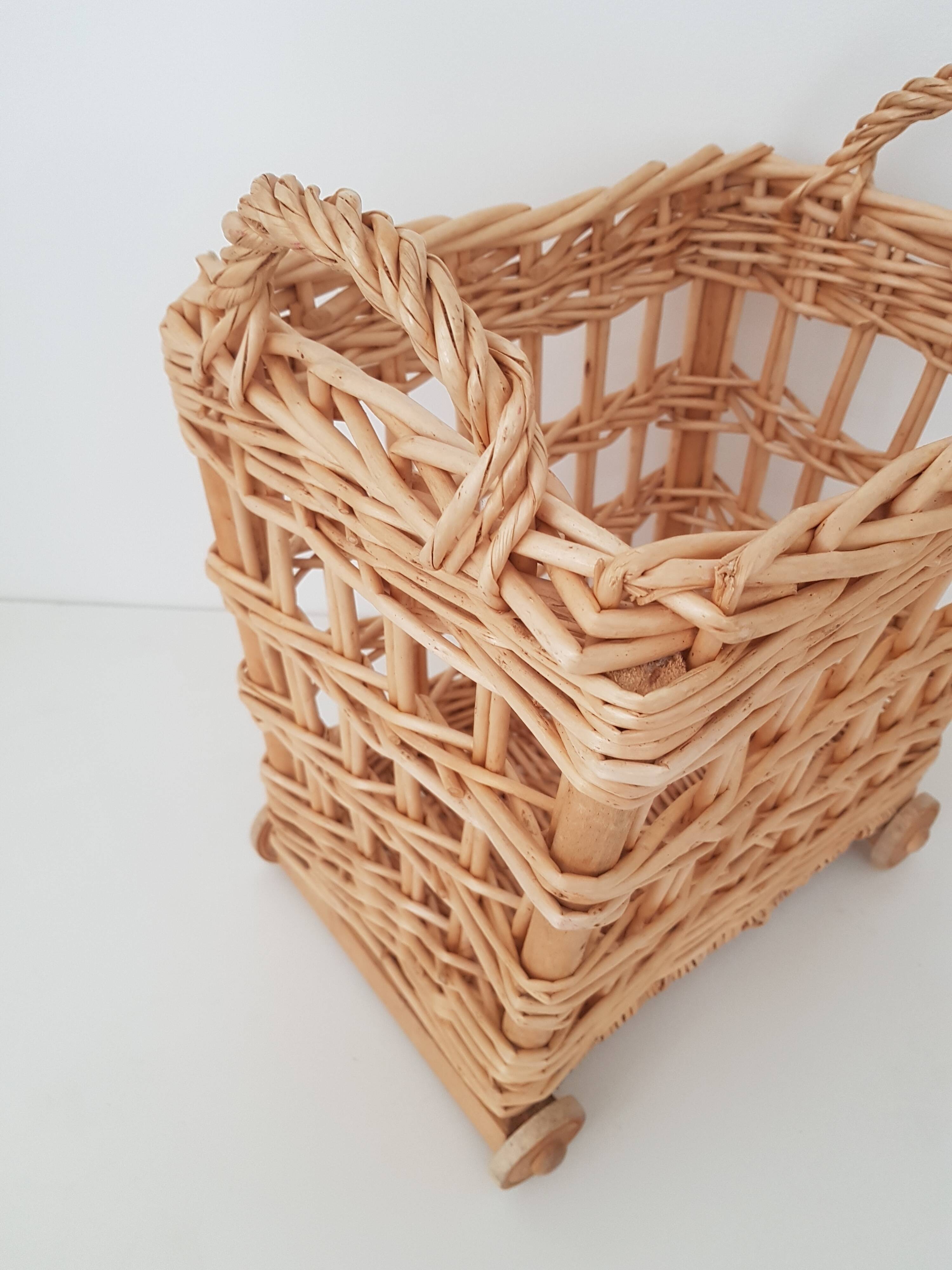 Vintage wicker basket on wheels - children's toy trolley