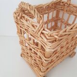 Vintage wicker basket on wheels - children's toy trolley