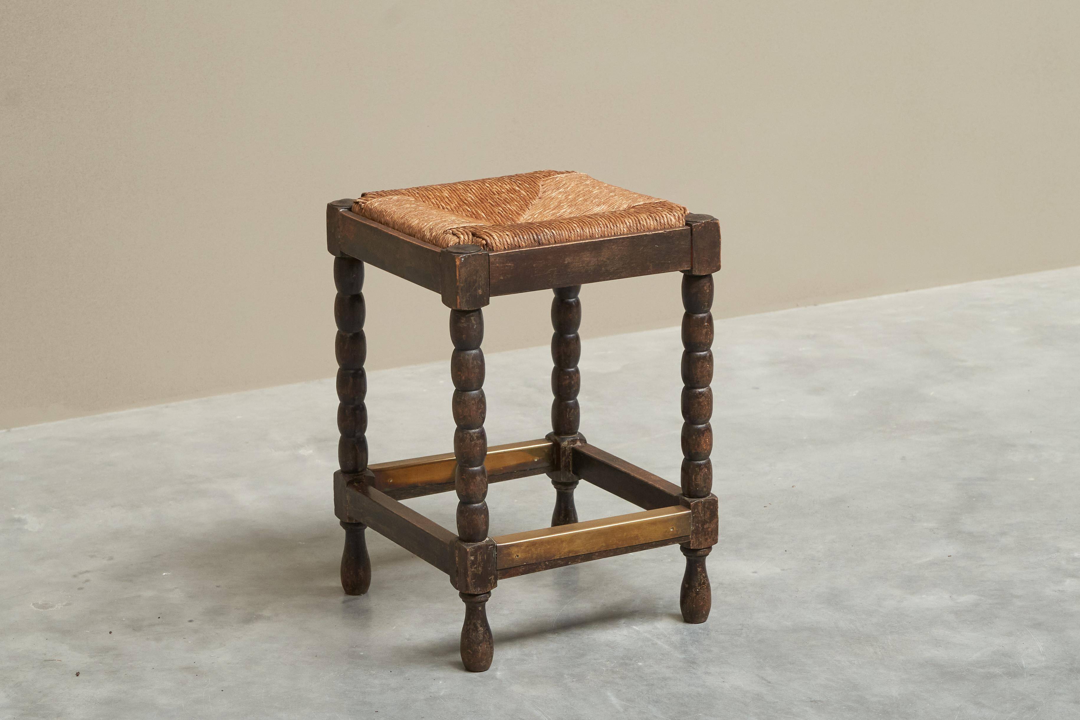 Solid oak stool, straw and brass from the 1920s.