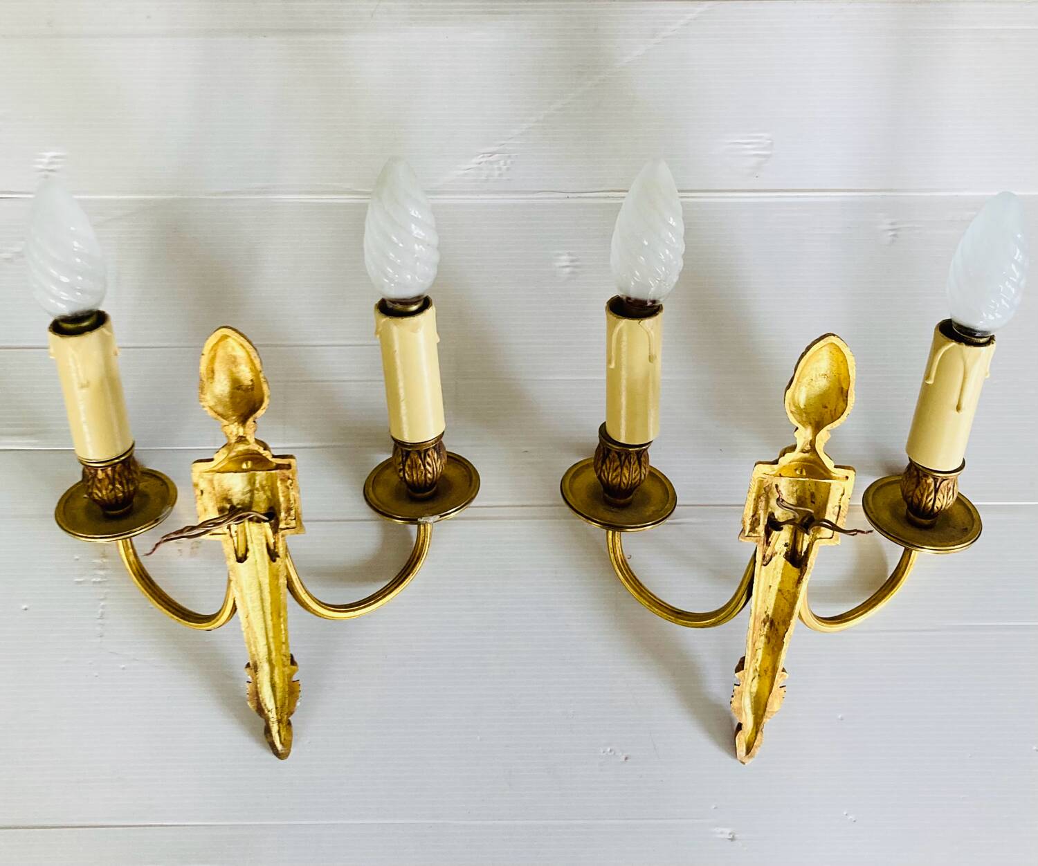 St Louis XVI gilded bronze wall lights with foliage and pine cone decorations