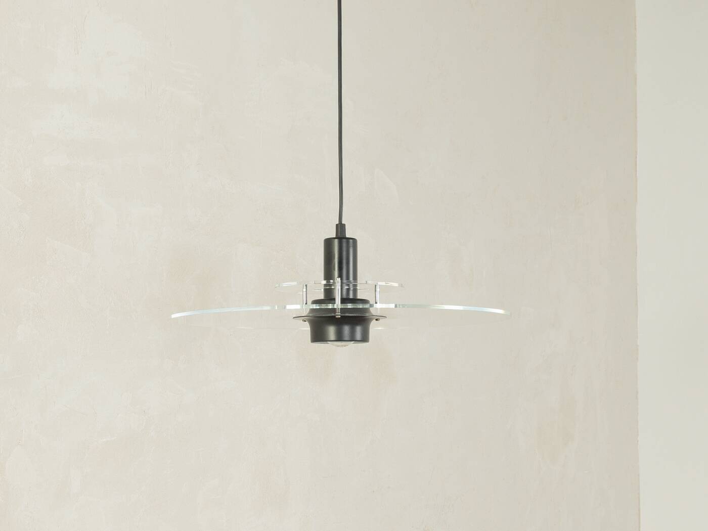 Space Age ceiling lamp by Ikea from the 1980s with two plexiglass plates and canopy made of black injection-moulded plastic.