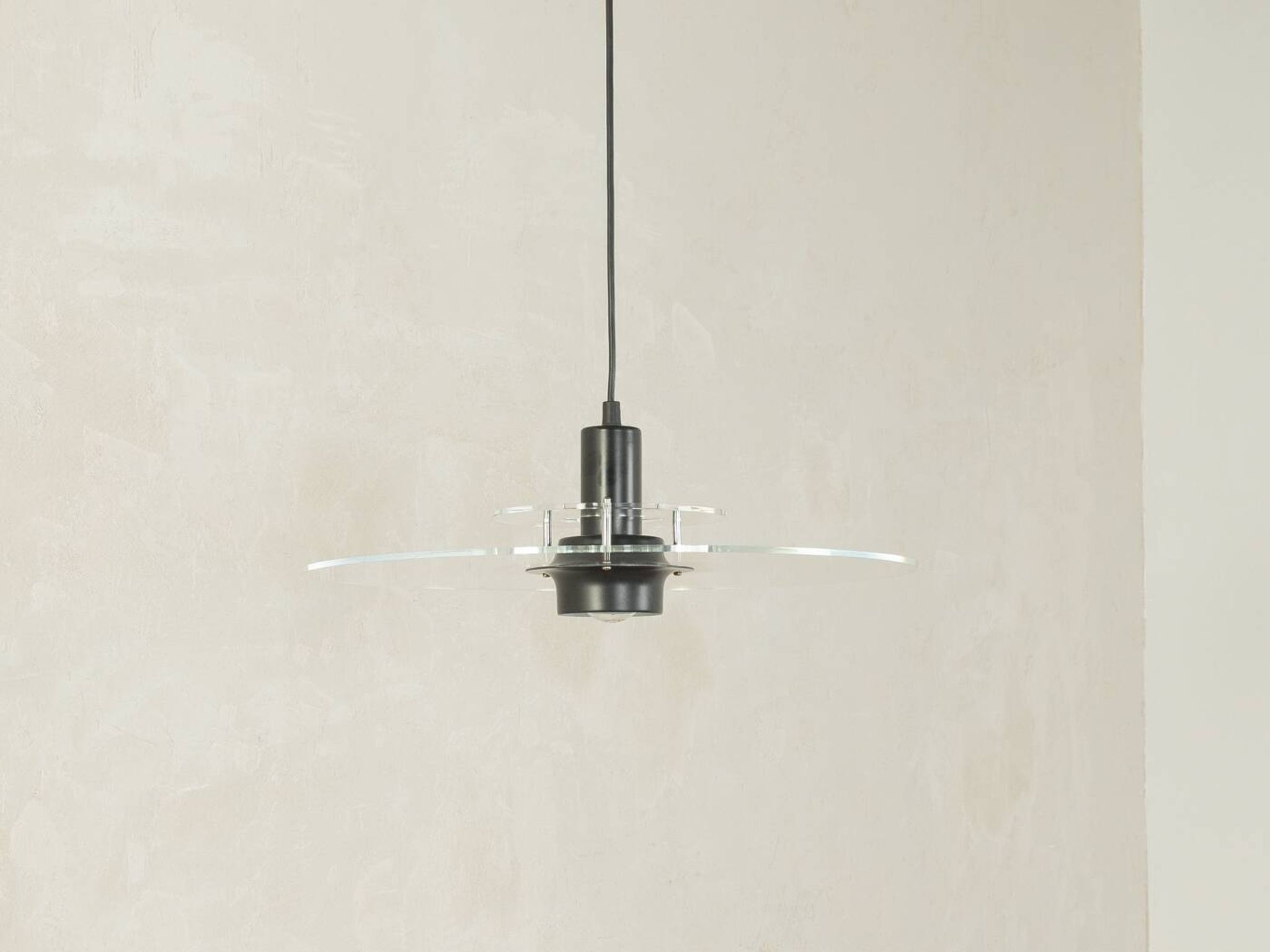 Space Age ceiling lamp by Ikea from the 1980s with two plexiglass plates and canopy made of black injection-moulded plastic.