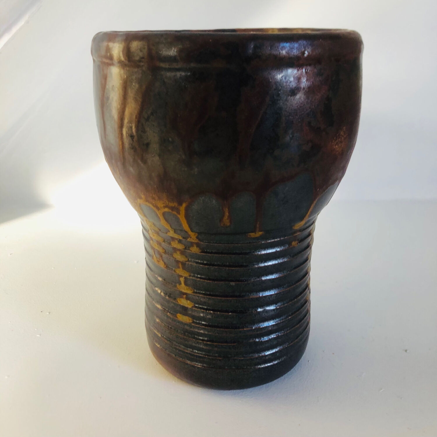 Metallic brown ceramic torso vase