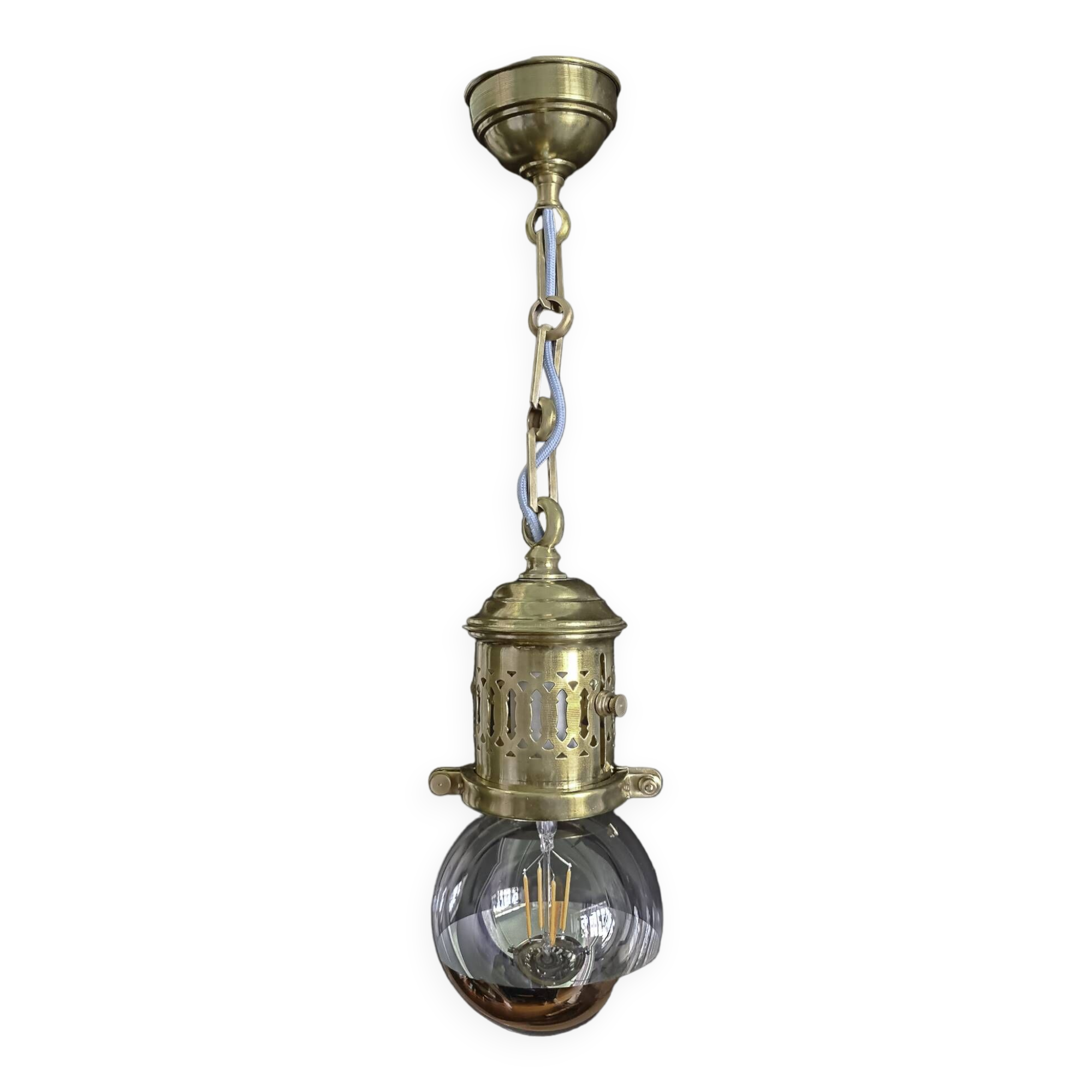 Brass pendant light with oversized LED bulb