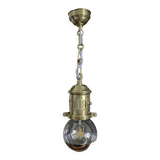 Brass pendant light with oversized LED bulb