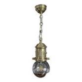 Brass pendant light with oversized LED bulb