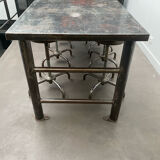 Industrial table with 6 pneumatic stools.