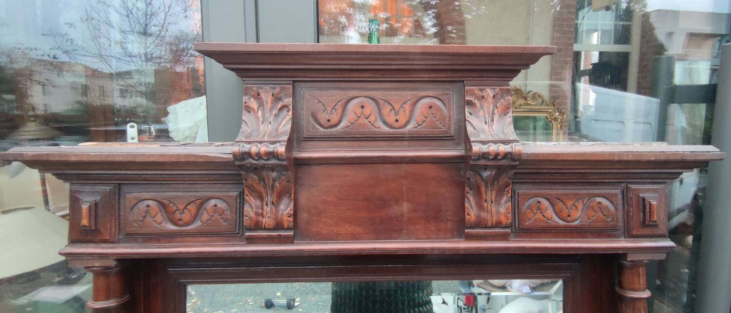 Old large carved wooden mirror