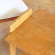 Bedside or side table with compass legs.