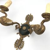 Antique bronze wall light with arm decorated with swans and palmettes in the Empire style