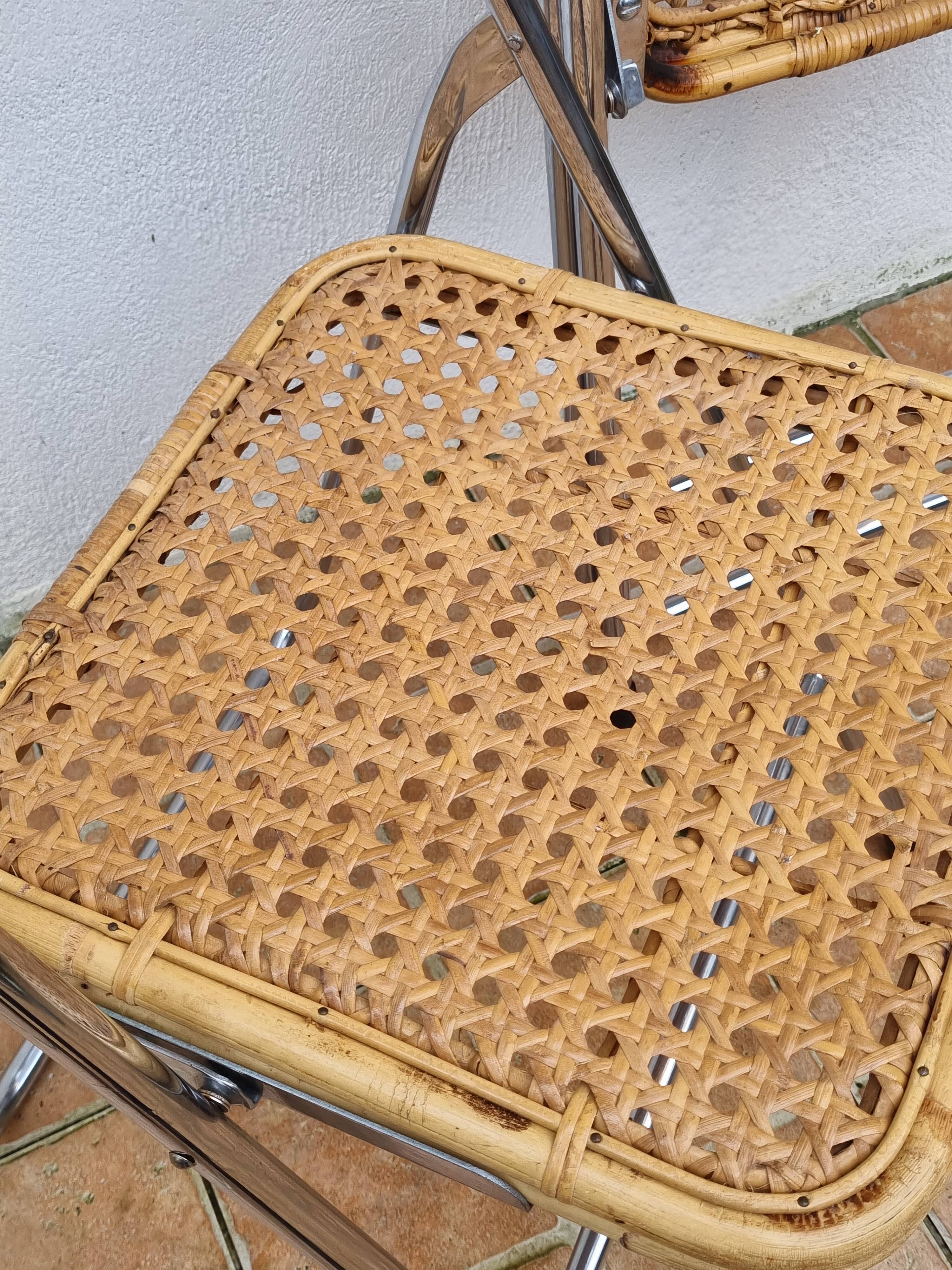 Pair of vintage metal and cane folding chairs