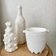 Trio of white vases