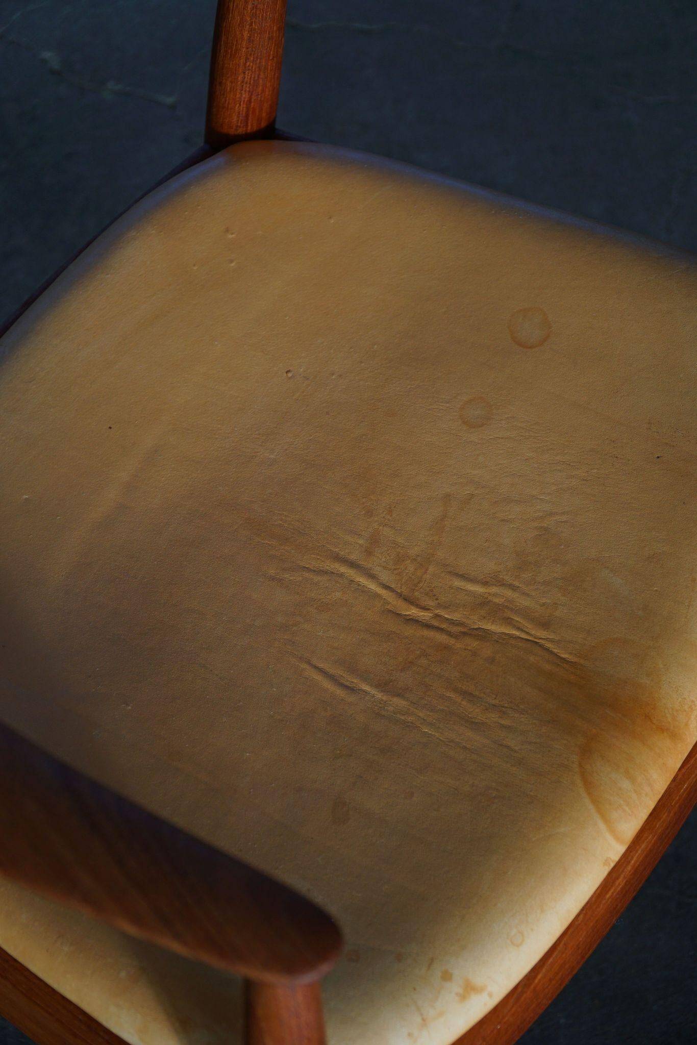 Hans J. Wegner, Teak and leather armchair, model "The Chair" JH501, 1950s