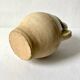 Old small goat-shaped jug in ochre glazed stoneware.
